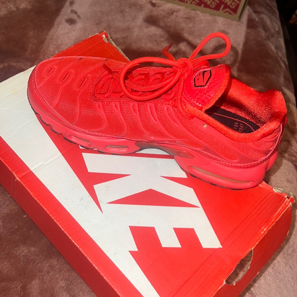 All red Nike Air Max Plus